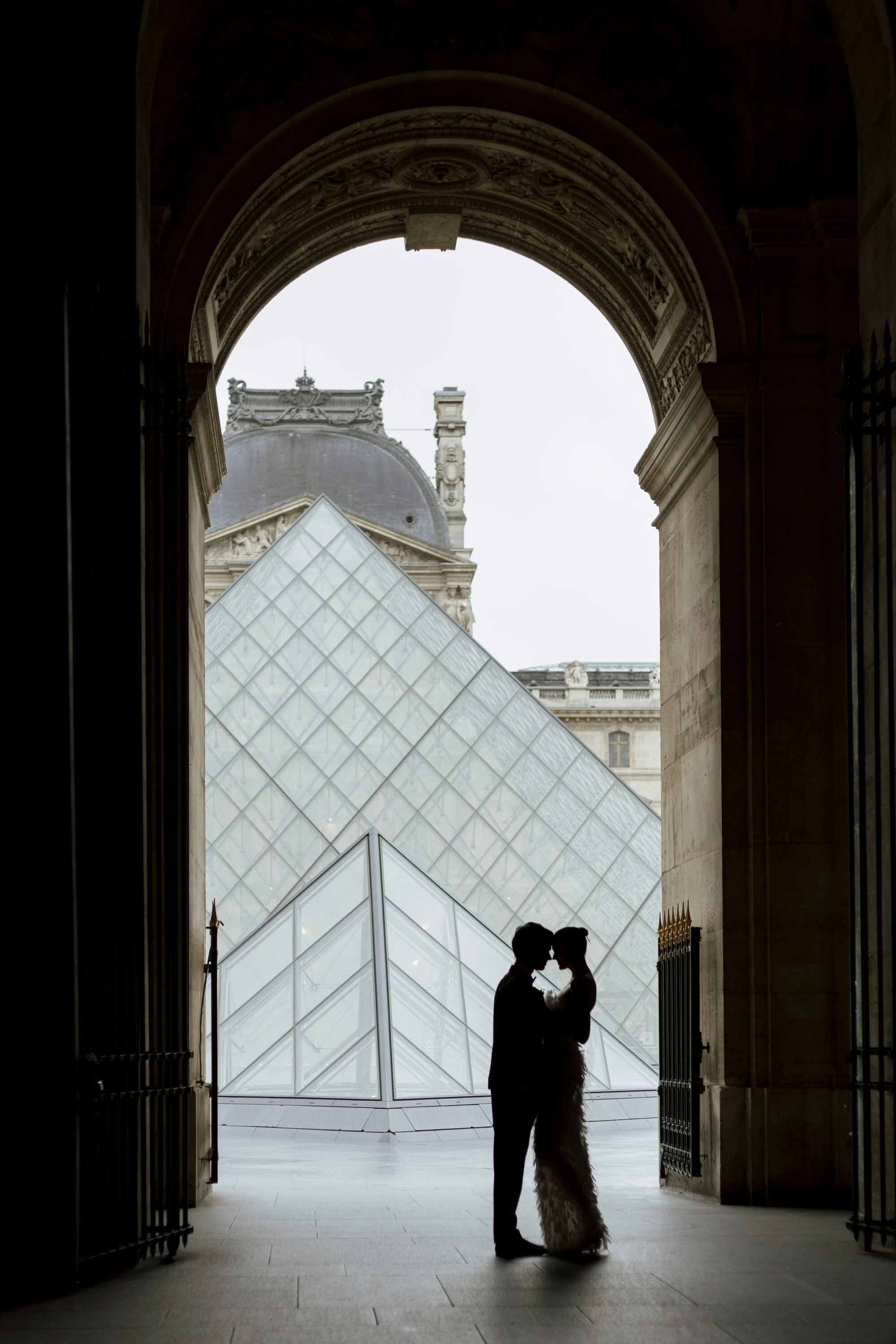 A table topped with two wine glasses and plates